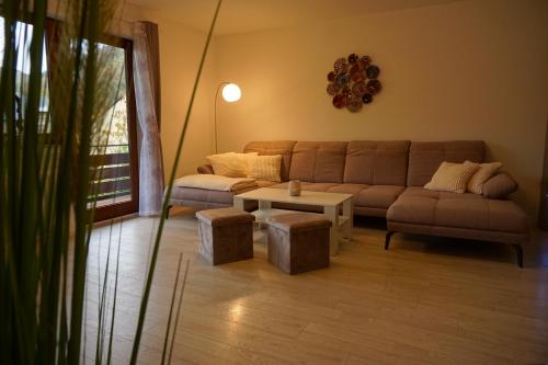 a living room with a couch and a table at Haus zur Sonne in Bad Bertrich