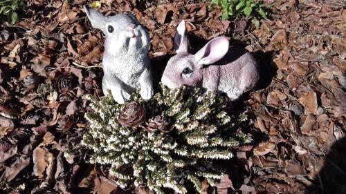 two rabbits are standing next to a christmas tree at Villa Della Stua in Cormòns