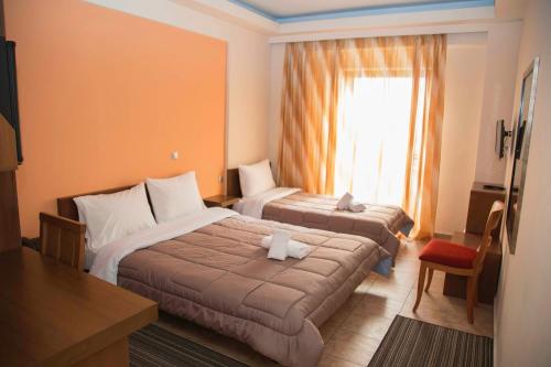 Postel nebo postele na pokoji v ubytování Hotel Giorgio