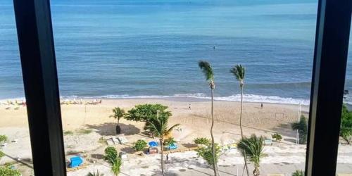 a view of a beach with palm trees and the ocean at Avenida Beira Mar, The Best view! in Fortaleza