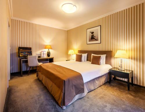 Posteľ alebo postele v izbe v ubytovaní Ambra Hotel