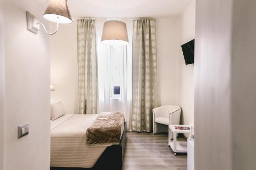Postelja oz. postelje v sobi nastanitve Angolo di Roma Guest house