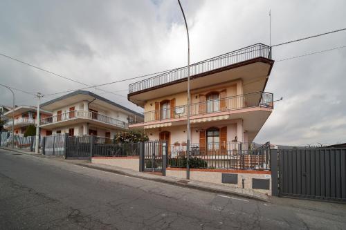 a building on the side of a street at B&B Le Tre rose dell'Etna in Zafferana Etnea