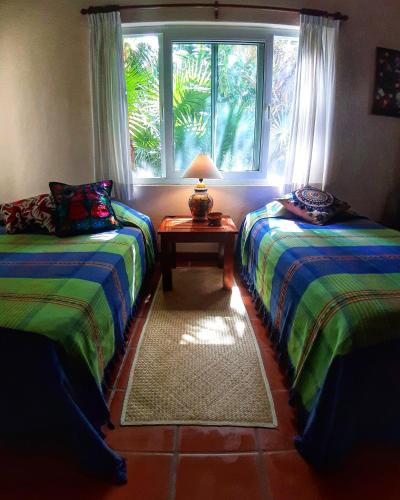 Katil atau katil-katil dalam bilik di Casa Kin33