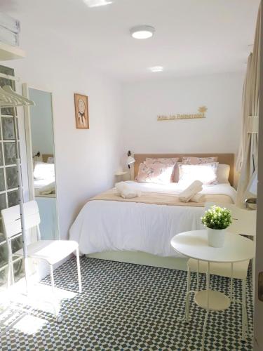a bedroom with a bed and a table and chairs at Marbella Center Apartment in Marbella