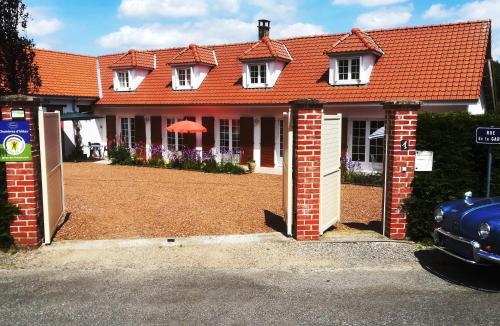 a house with an orange roof and a driveway at Rêve d'Authie in Dompierre-sur-Authie