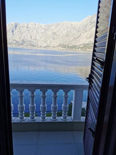 a view of the water from a balcony at Apartments Popovic in Kotor