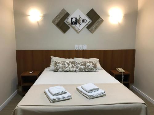 Кровать или кровати в номере Hotel Portal das Águas