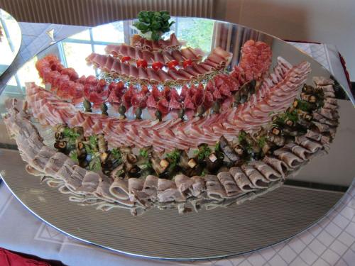 a large display of food on a glass table at Landhotel Hirschen in Trüllikon