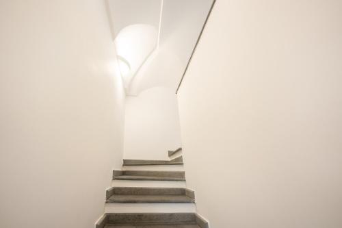 a staircase in a building with white walls at Vento di mare in Procida