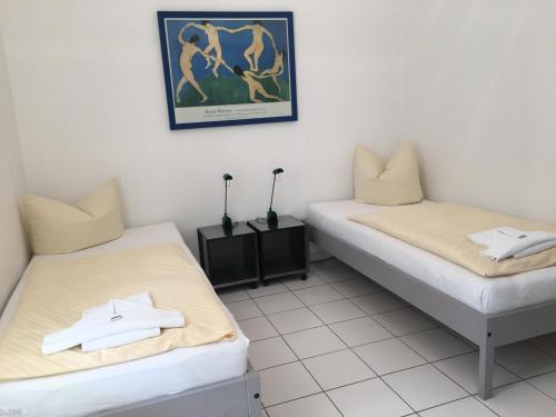 Villa Caprivi - Ferienwohnung 5にあるベッド