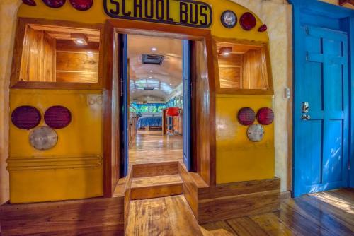 a school bus entrance with a school bus at Tree House Beachfront Lodge in Puerto Viejo