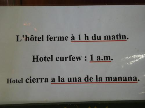 a sign with the name of a hospital at Hotel des Belges in Paris