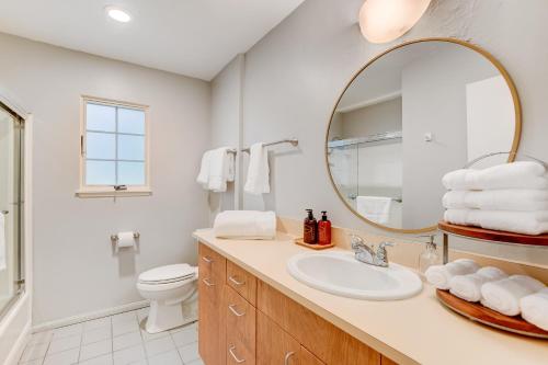 a bathroom with a sink and a mirror at Private Suite in San Diego
