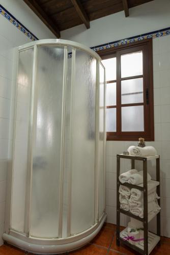a shower stall in a bathroom with towels at Casa Carolina 2 in Las Indias