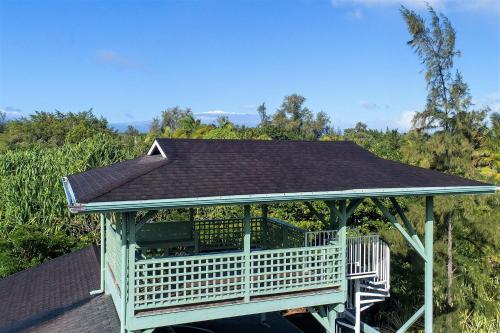 a gazebo with a roof on top of it at Hale Ki'i Maka Manu home in Keaau
