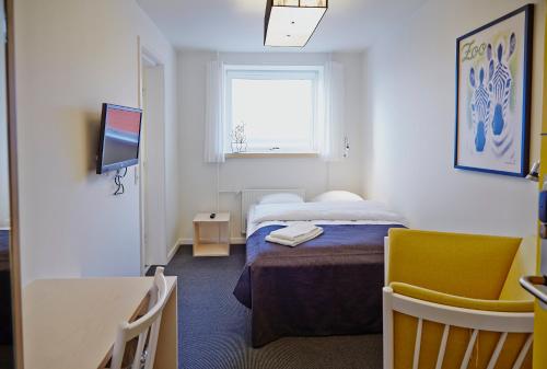 Postel nebo postele na pokoji v ubytování Severin Kursuscenter og Konferencehotel