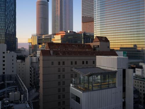 a view of a city skyline with tall buildings at 9h nine hours Nagoya station in Nagoya