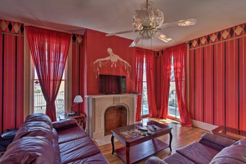 a living room with red curtains and a couch at 1 Mi to Beach Group-Friendly Galveston Home! in Galveston