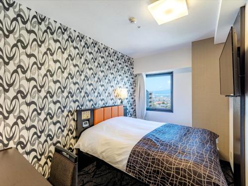 Postel nebo postele na pokoji v ubytování APA Hotel Biwako Seta Ekimae