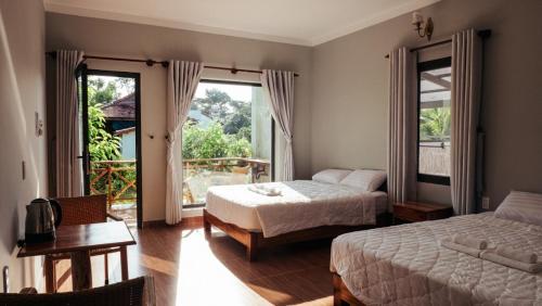 Giường trong phòng chung tại Phu Quoc Areca Garden Bungalow