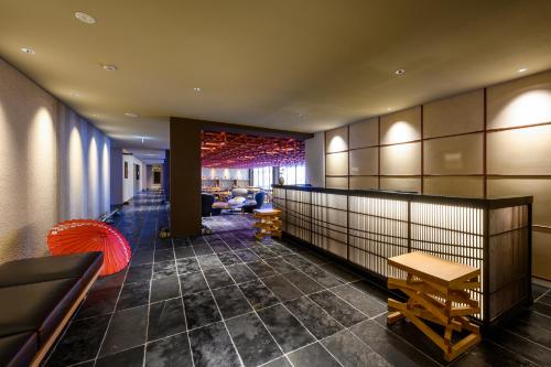a lobby of a hotel with a waiting room at HOTEL WOOD TAKAYAMA in Takayama