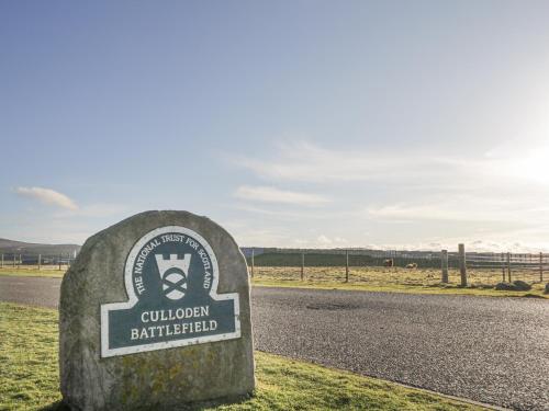 a stone sign for aolkien battlefield on the side of a road at The Nook in Inverness