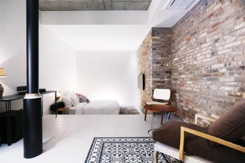 a living room filled with furniture and a fireplace at Boutique Hotel Loft in Seoul