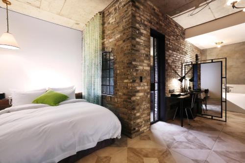 Una cama o camas en una habitación de Boutique Hotel Loft