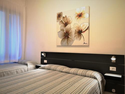 Postel nebo postele na pokoji v ubytování Hotel Rossi
