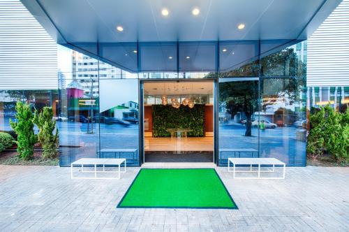 a building with a green mat in front of it at Holiday Inn Belo Horizonte Savassi, an IHG Hotel in Belo Horizonte