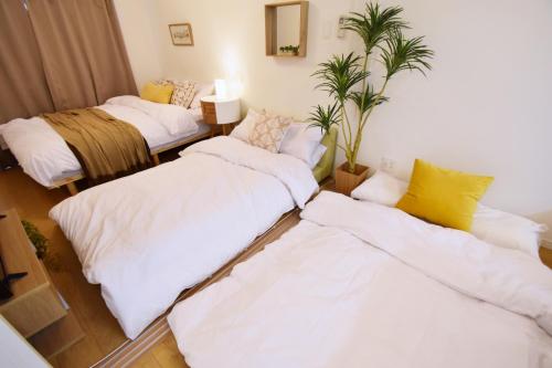 Ένα ή περισσότερα κρεβάτια σε δωμάτιο στο Mishuku Onna202