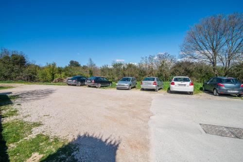 a group of cars parked in a parking lot at Apartment Studio Lara in Rovinj