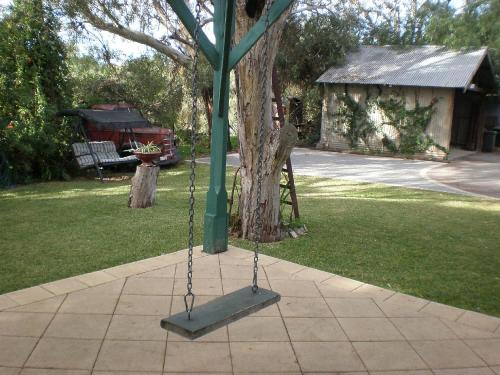 a swing in a yard next to a tree at Eagle Foundry Bed & Breakfast in Gawler
