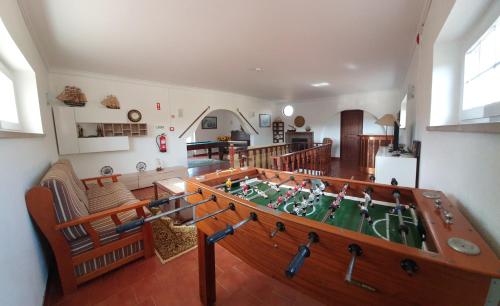 a room with a table in the middle of a room at Villa Tumbine in Cascais