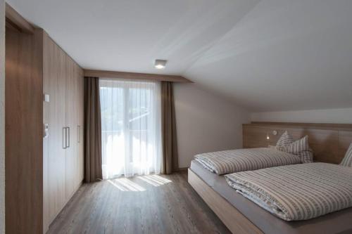 Ein Bett oder Betten in einem Zimmer der Unterkunft Haus Pipperger
