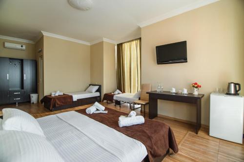 Postel nebo postele na pokoji v ubytování Hotel Egrisi