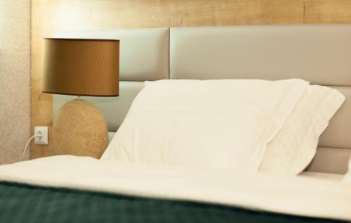 Ένα ή περισσότερα κρεβάτια σε δωμάτιο στο AZPETROL HOTEL KURDEMIR