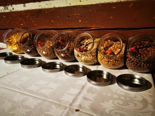 a row of bowls filled with different types of food at Chata pod Studničnou in Pec pod Sněžkou