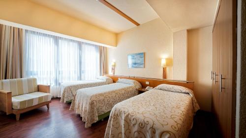 A bed or beds in a room at Bull Astoria