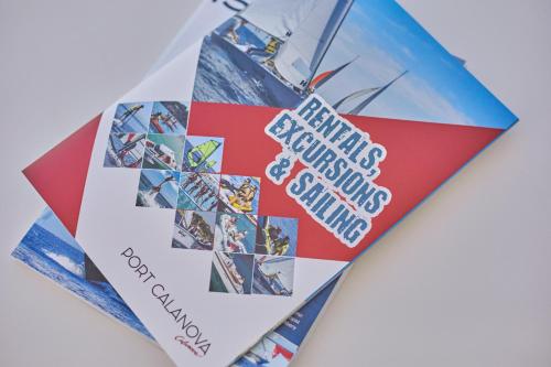 a book with a bookmark on top of it at Calanova Sports Residence in Palma de Mallorca