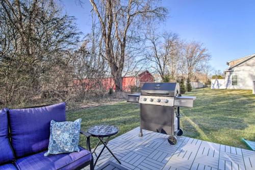 a barbecue on a patio with a purple couch at 2 Mi to Bethany Beach Family-Friendly Home! in Ocean View