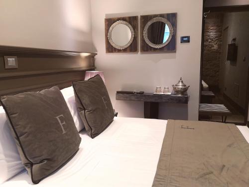 Postel nebo postele na pokoji v ubytování Forvm boutique Hotel