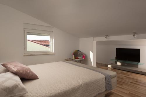 Posteľ alebo postele v izbe v ubytovaní Apartment AleMar