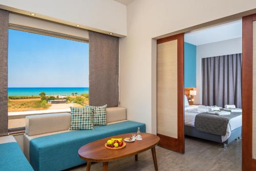 a hotel room with a view of the ocean at Solimar Aquamarine Resort in Gerani Chanion