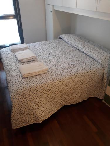 Ένα ή περισσότερα κρεβάτια σε δωμάτιο στο Le Torri Apartments