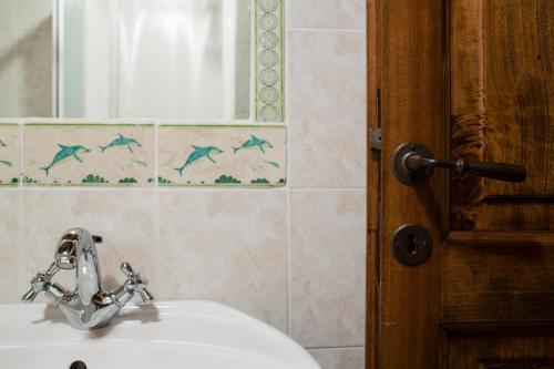 a bathroom with a sink and a mirror at Monastero San Silvestro in Cortona