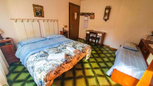 Ein Bett oder Betten in einem Zimmer der Unterkunft Bed and breakfast Giuseppina