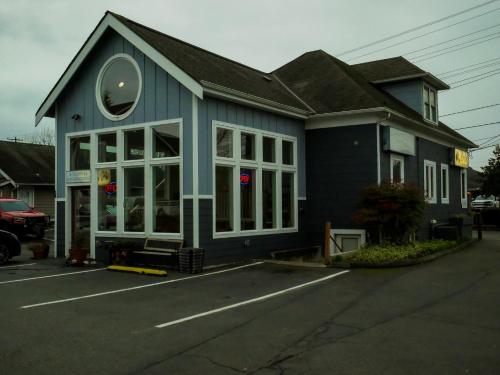 a blue building with a lot of windows at Snohomish Inn in Snohomish