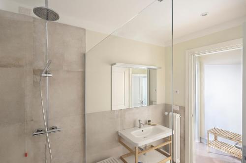 a bathroom with a sink and a shower at Apt. Perla - Pauline Suites, Palazzo Borghese in Florence